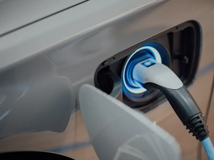Charging cable connected to a hybrid car – illustration