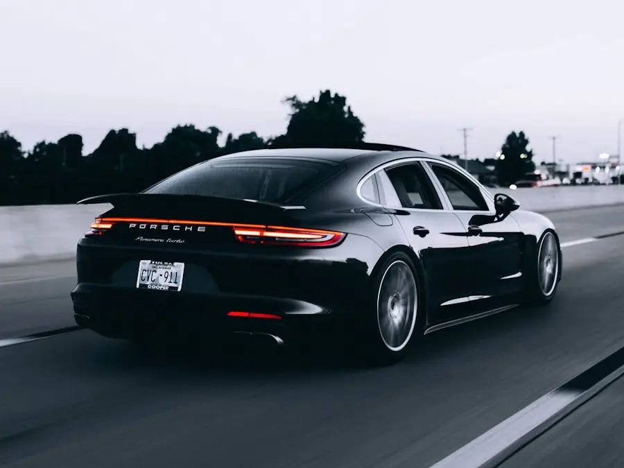 Dark premium sedan driving on the motorway – illustration
