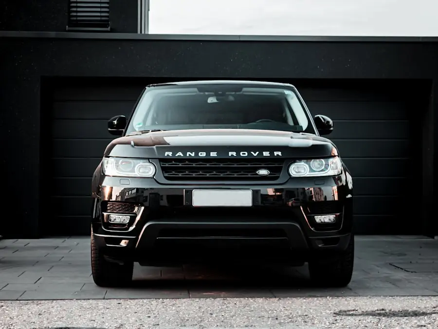 Black premium SUV from the front, in front of a modern garage – illustration
